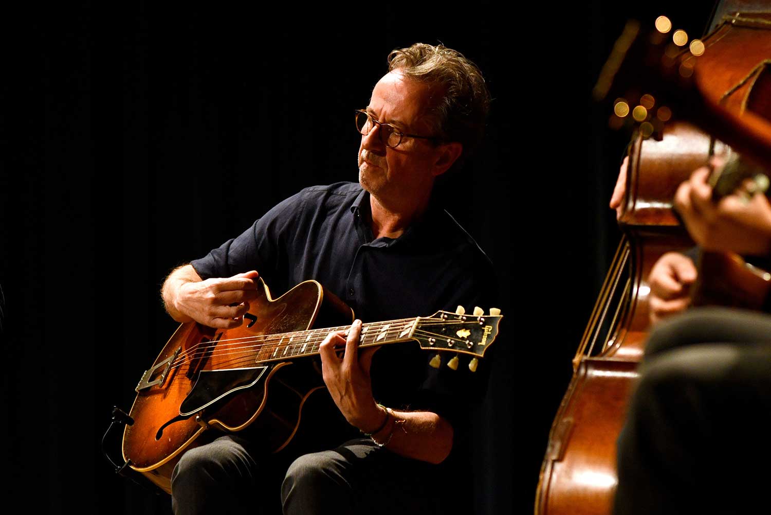 Dave Kelbie Dave Kelbie playing guitar in concert