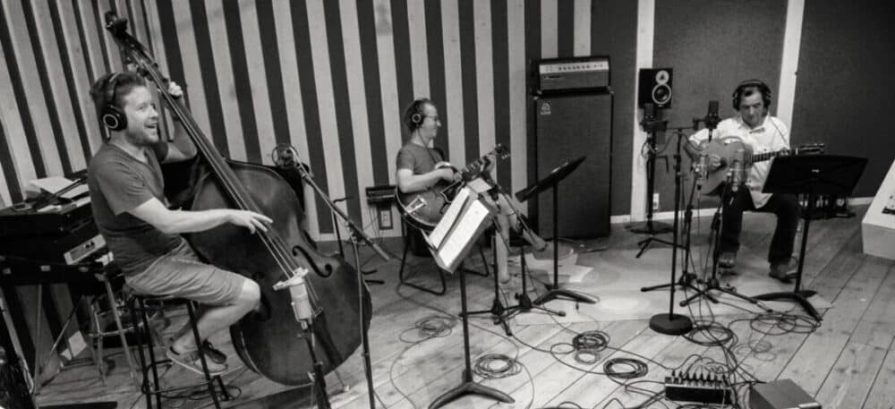 Sebastien Girardot, Dave Kelbie, Fapy Lafertin in the recording studio black and white