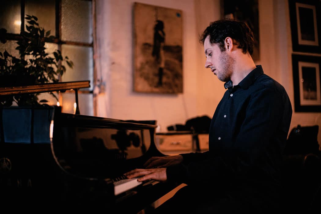 Sam Watts playing piano