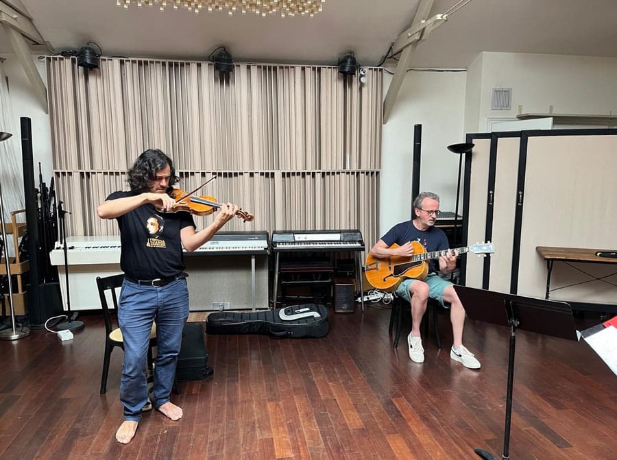 Recording studio shot of UK guitarist Dave Kelbie and Tcha Limberger recording with The Viper Club